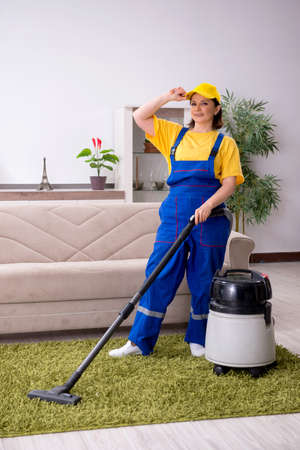 Old female contractor doing houseworkの写真素材