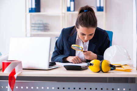 Young female architect working in the officeの写真素材