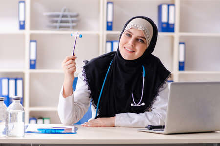 Young doctor in hijab working in the clinicの写真素材