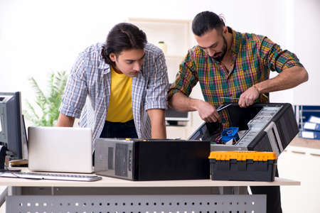 IT engineers working on hardware issue