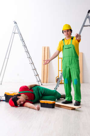Injured worker and his workmateの写真素材