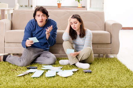 Young couple in budget planning conceptの写真素材