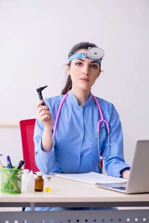 Young female doctor working in the clinicの写真素材