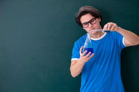 Young male student in the classroomの写真素材