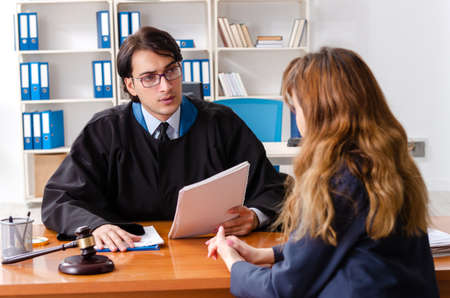 Young woman visiting male lawyer