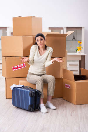 Young woman moving to new flat