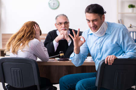 Young couple in the courthouse in divorce conceptの写真素材