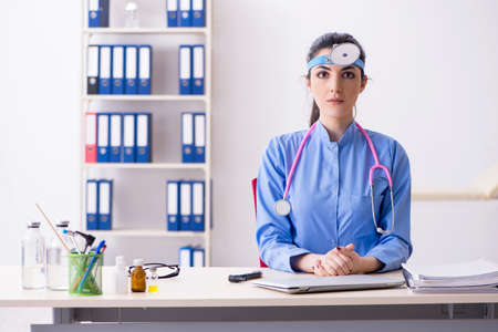 Young female doctor working in the clinicの写真素材