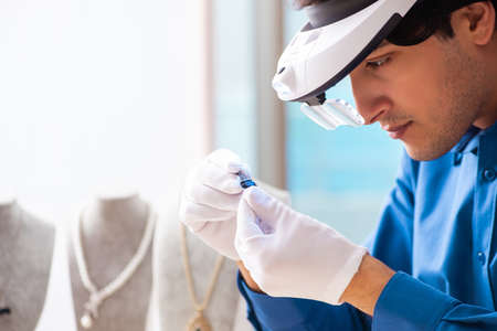 Young jeweler working in his workshop