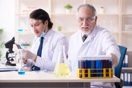 Two chemists working in the labの写真素材
