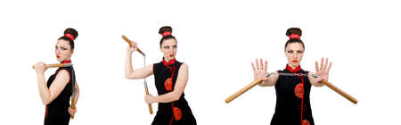 Funny woman with nunchucks isolated on whiteの写真素材