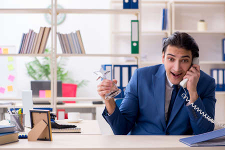 Young handsome employee in the officeの写真素材