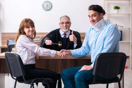 Young couple in the courthouse in divorce conceptの写真素材