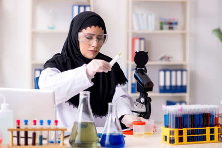 Female chemist in hijab working in the labの写真素材