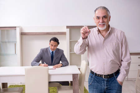 Male real estate agent and male client in the apartment
