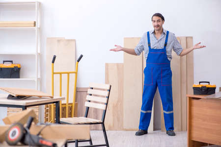 Young male carpenter working indoorsの写真素材