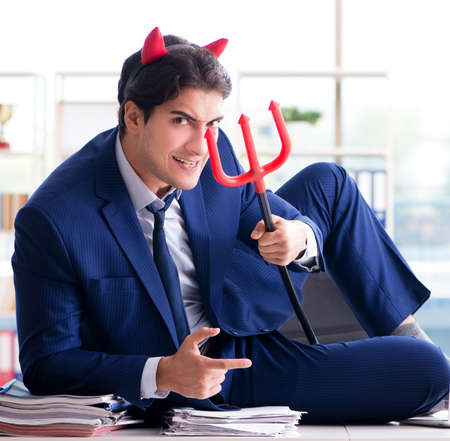 Devil angry businessman in the officeの写真素材