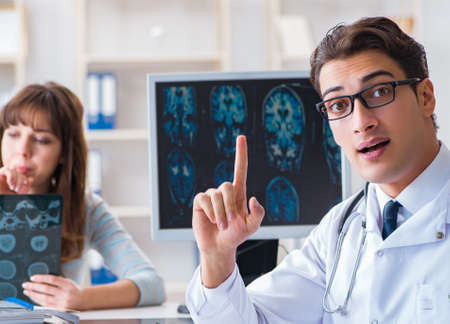 Young woman visiting radiologist for x-ray examの写真素材