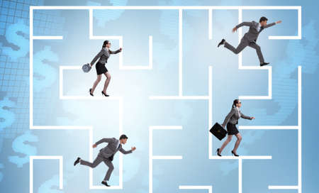 Business people getting lost in maze uncertainty conceptの写真素材