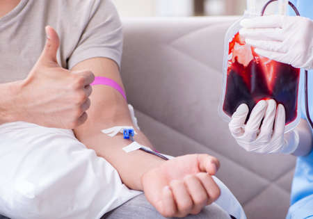 Patient getting blood transfusion in hospital clinicの写真素材