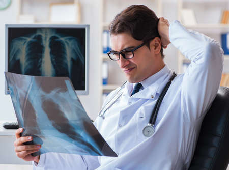 Doctor radiologist looking at x-ray images