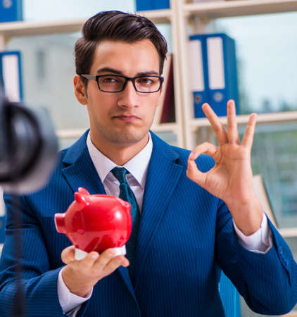 Businessman recording a video for vlogの写真素材