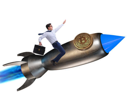 Businessman flying on rocket in bitcoin price rising conceptの写真素材