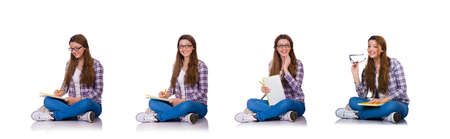 Young student with books isolated on the whiteの写真素材