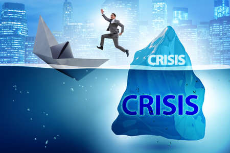 Crisis concept with businessman on icebergの写真素材