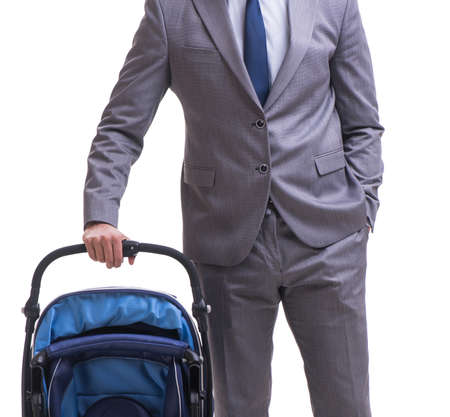 Young businessman nursing child in pram isolated on whiteの写真素材