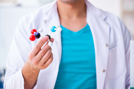Young male chemist working in the labの写真素材