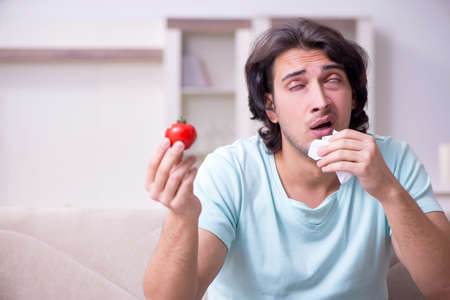 Young man suffering from allergyの写真素材