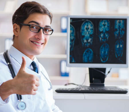 Doctor radiologist looking at x-ray imagesの写真素材