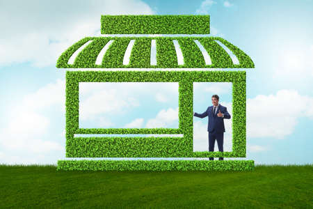 Businessman in green housing conceptの写真素材