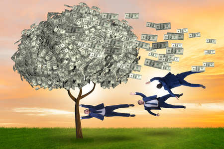 Businessman blown away from the money treeの写真素材