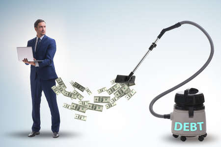 Businessman and vacuum cleaner sucking money out of him