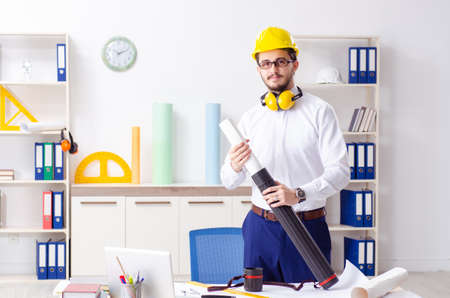 Young male architect working in the office