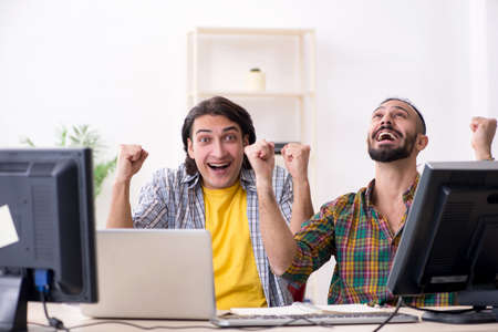 Two it specialists working in the officeの写真素材