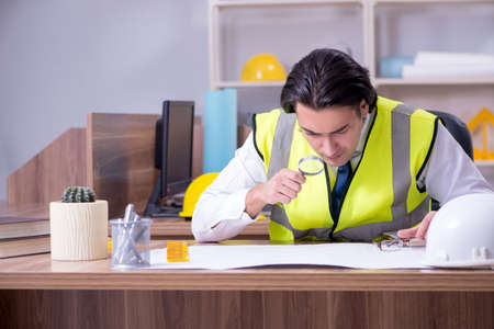 Young male architect working in the officeの写真素材