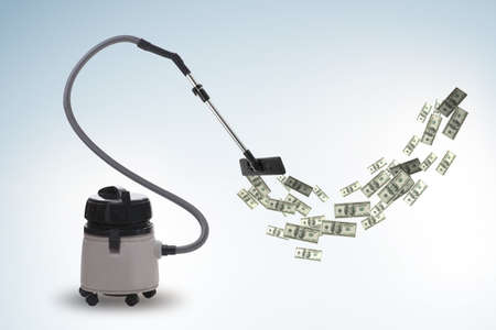 The vacuum cleaner sucking money dollarsの写真素材