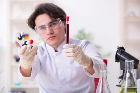 Young male biochemist working in the labの写真素材