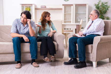 Young pair visiting experienced doctor psychologistの写真素材