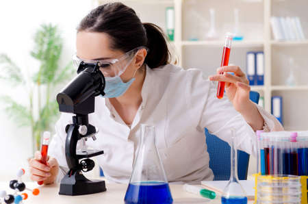 Young female chemist working in the labの写真素材