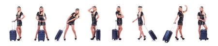 Woman travel attendant with suitcase on whiteの写真素材