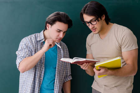 Two male students in the classroomの写真素材