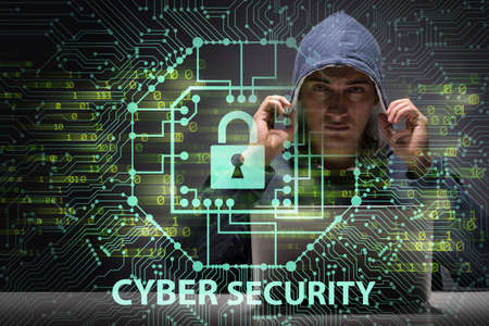 Young hacker in cybersecurty conceptの写真素材