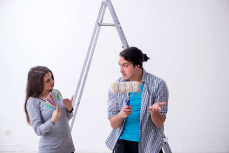 Young family doing renovation at homeの写真素材