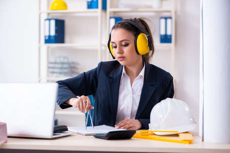 Young female architect working in the officeの写真素材