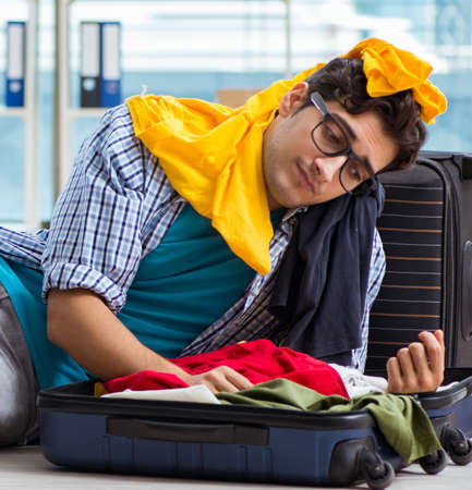 Young man preparing for vacation travelの写真素材