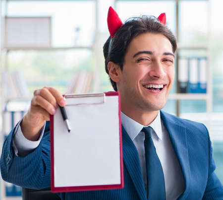 Devil angry businessman in the office